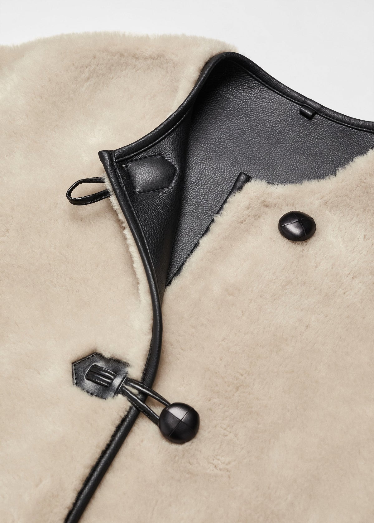 Faux fur coat with applications